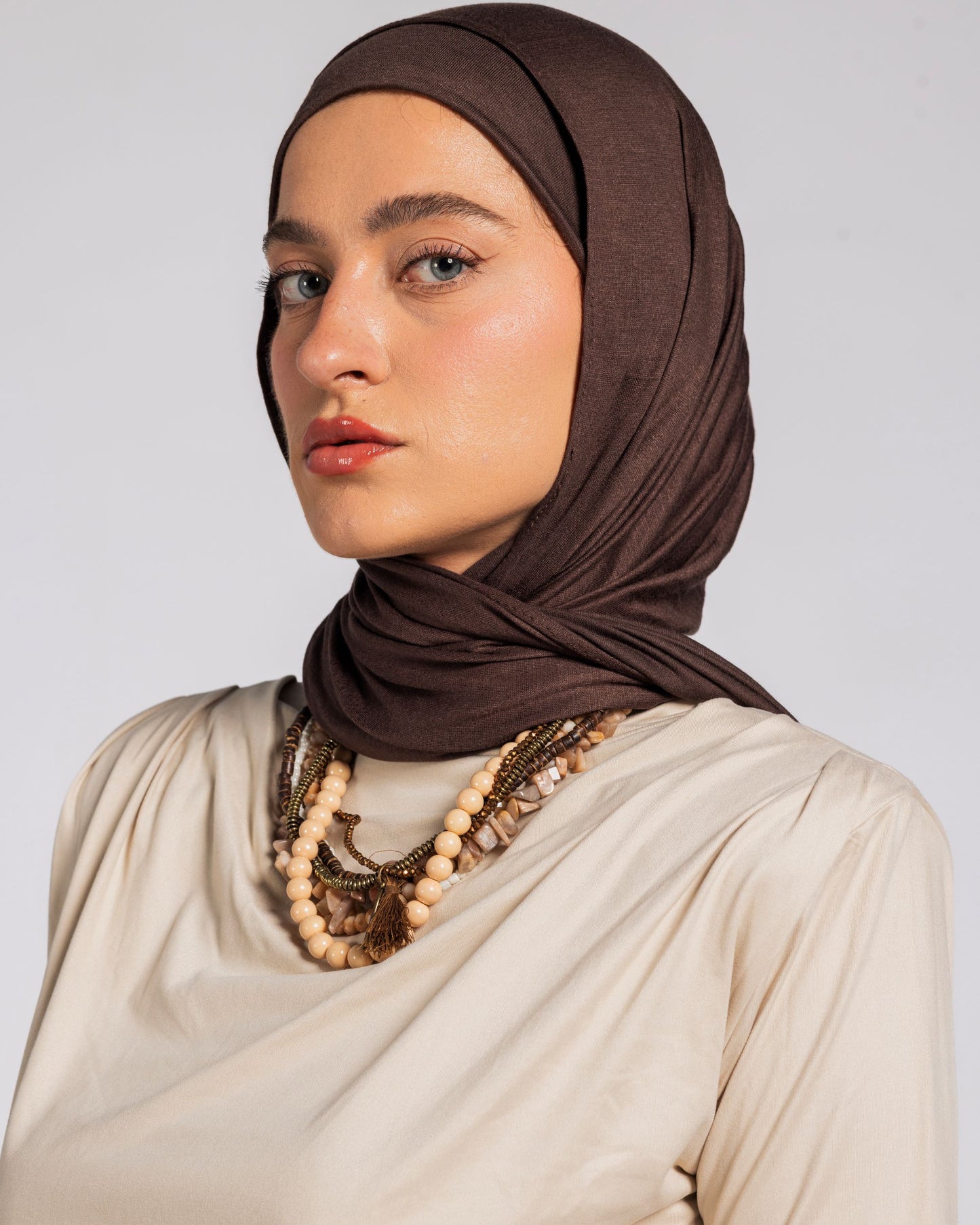 SHOULDER PADED DRAPED TOP - BEIGE